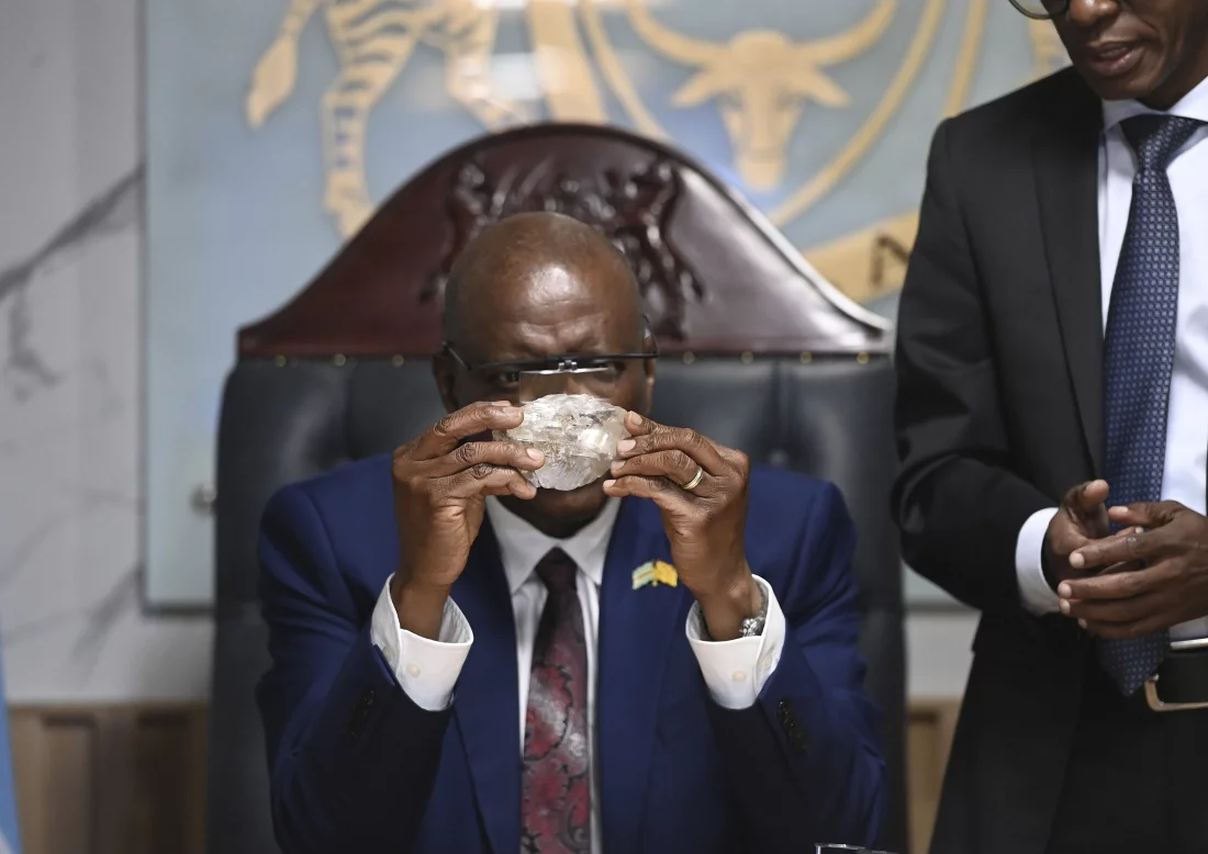 Botswana's President Mokgweetsi Masisi holds the 2,492-carat diamond that was unearthed at one of its mines and will be put on show, on Thursday, Aug. 22, 2024, in Gaborone. AP/AP