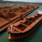 A bulk carrier loading high-grade Simandou iron ore at Guinea’s Morebaya port during the project’s first export shipments.
